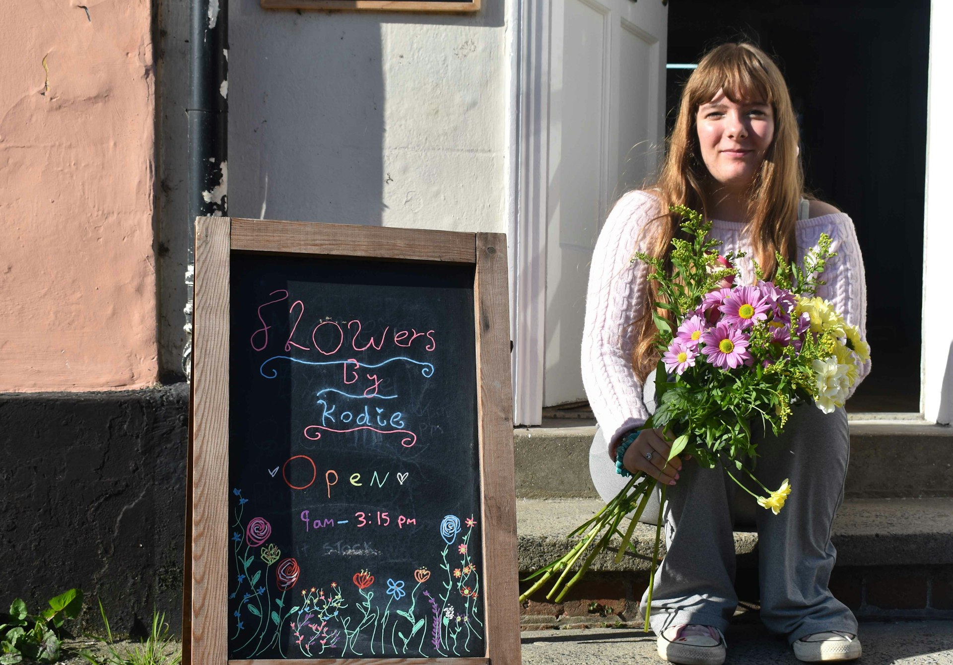 Kodie Brooke outside her own flower shop in Debenham